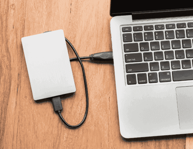 External hard drive connected to laptop for data backup and recovery
